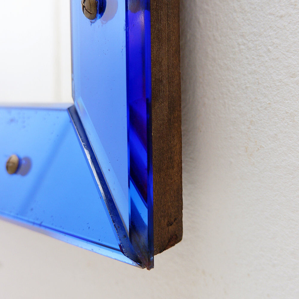 Mirror with a coloured glass frame attributed to Fontana Arte, Italy, circa 1950.