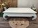 Low table in exotic wood with its safety glass protection