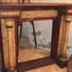 19th century wooden fireplace, faux marble paint. Can act as a console.
