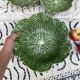 Large earthenware salad bowl in the shape of a cabbage leaf.