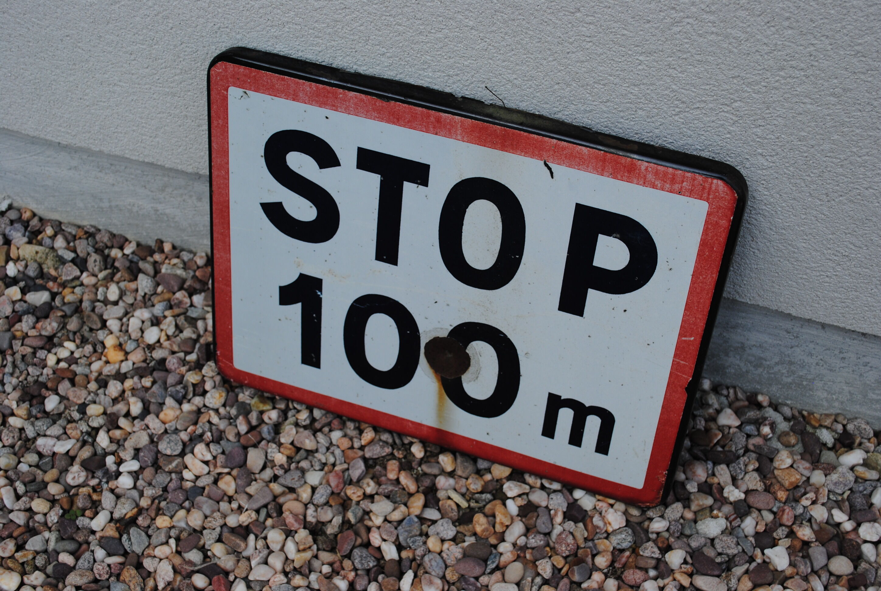 Enamelled sign Stop at 100 m