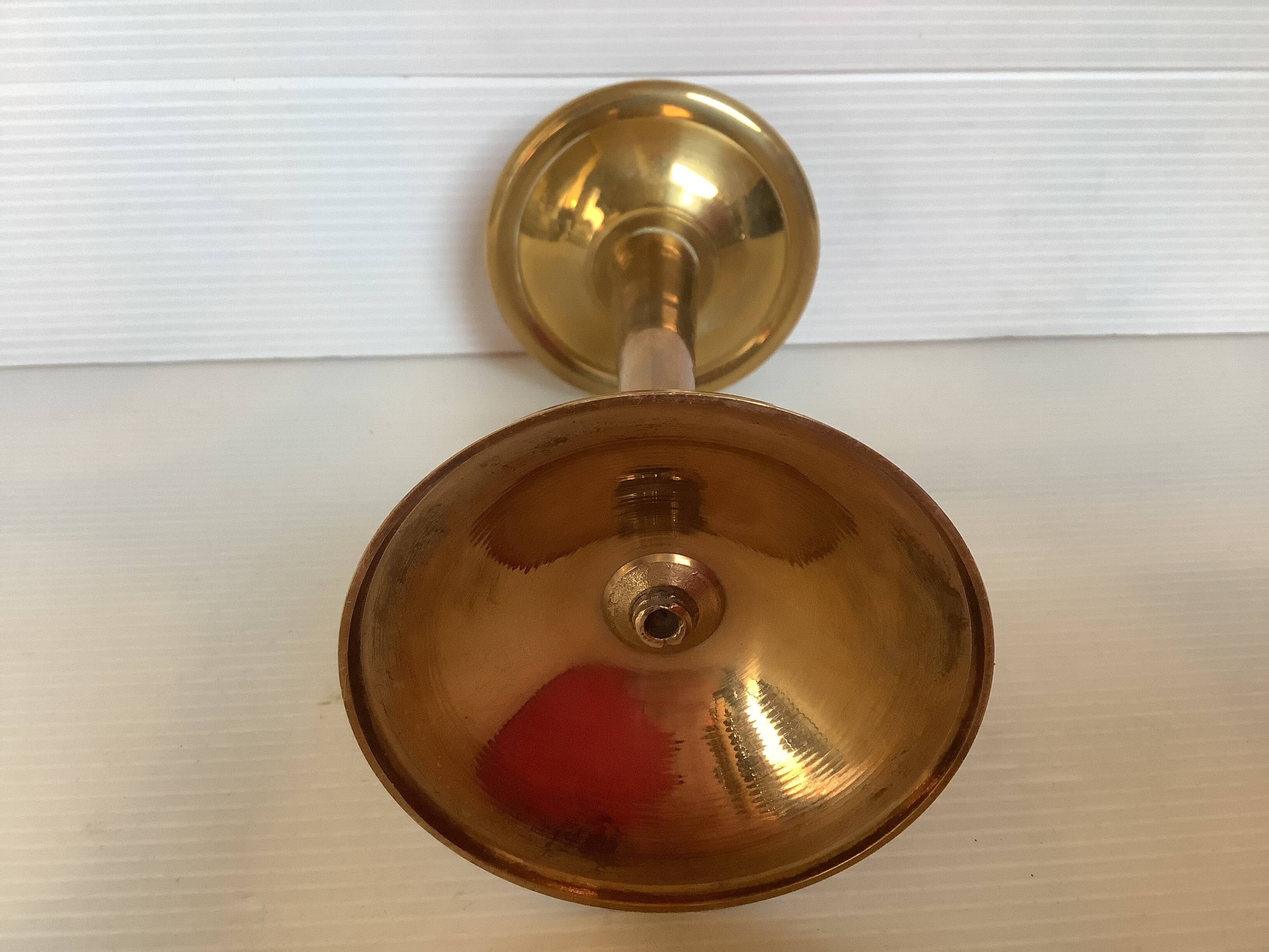 Asymmetrical brass candle holder
