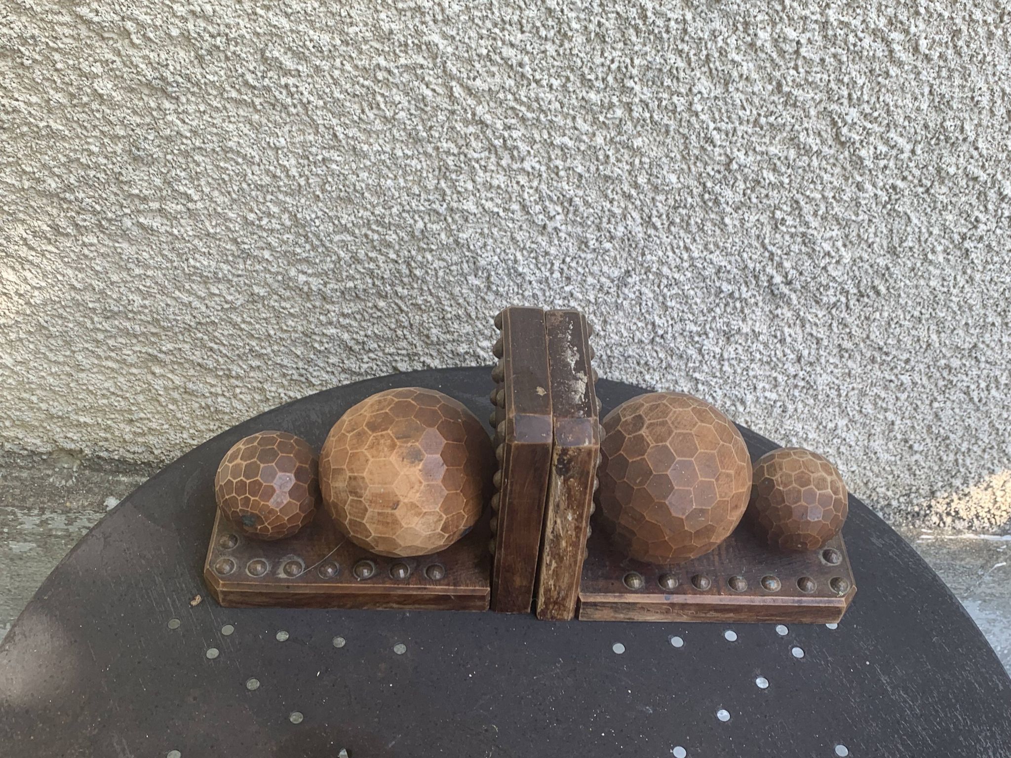 Pair of vintage carved wood and metal ball bookends