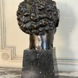 Head of a faun smiling, bronze after the antique, 19th century.