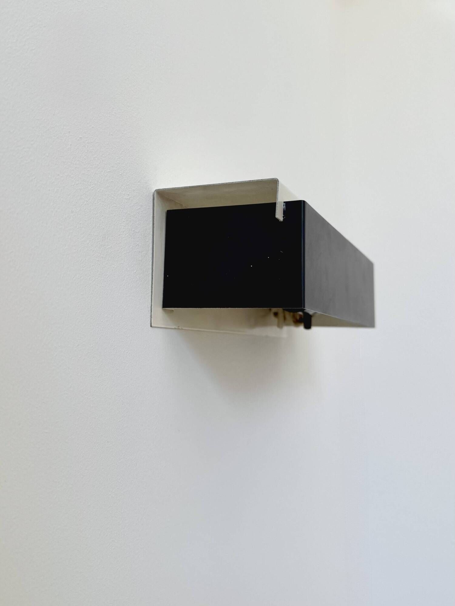 Pair of vintage wall sconces, painted black and white metal, Sweden 1970.