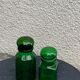 Two jars in green glass advertising vintage 1970
