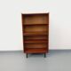 Vintage wooden bookshelf in teak style from the 1960s.