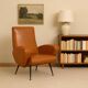 Small vintage armchair in faux leather, metal and brass, 1950s-1960s design.