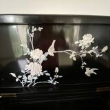 Black lacquered artisanal bar with mother-of-pearl inlays.