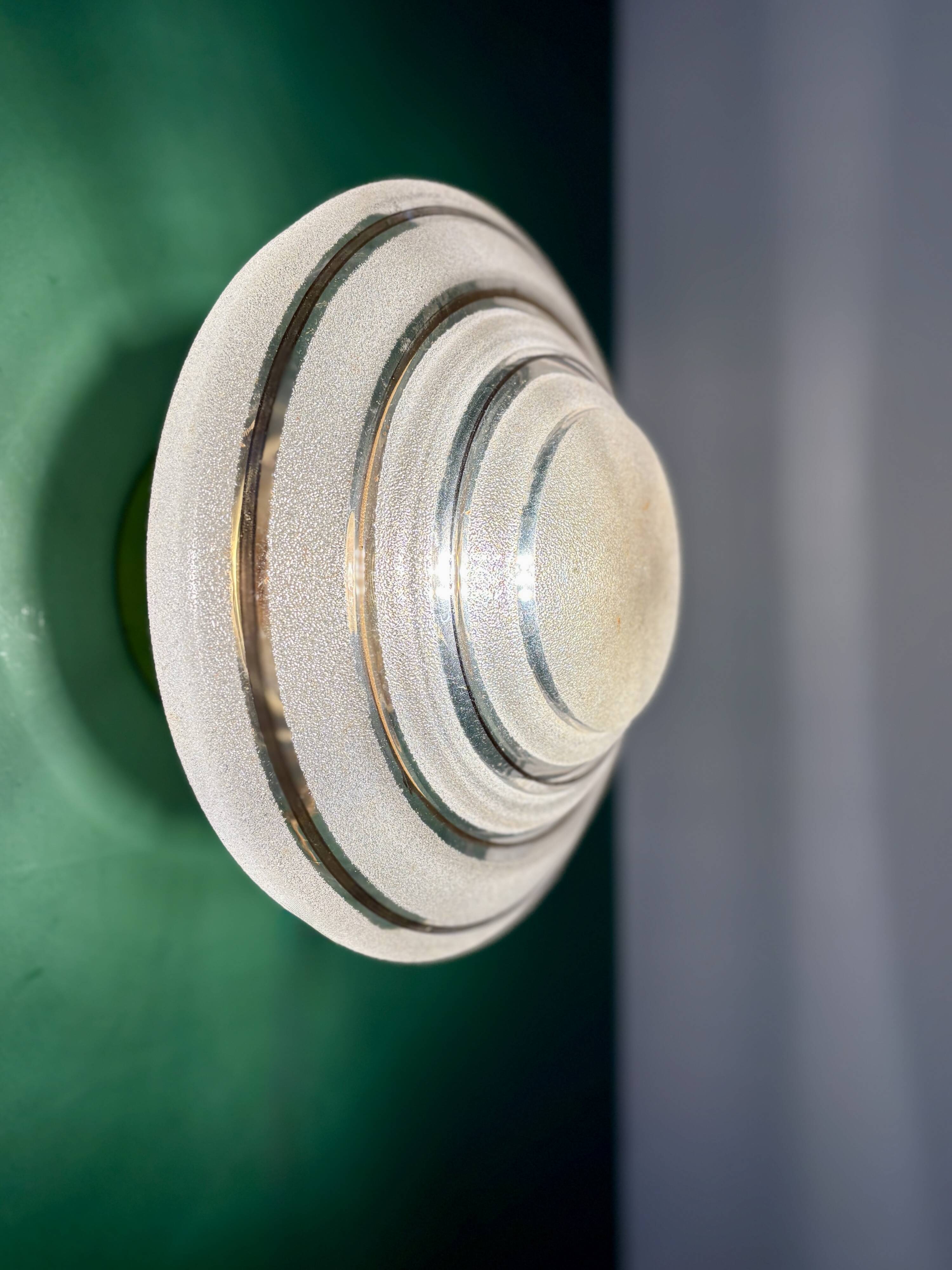 Old glass globe wall/ceiling light in frosted white and gold.