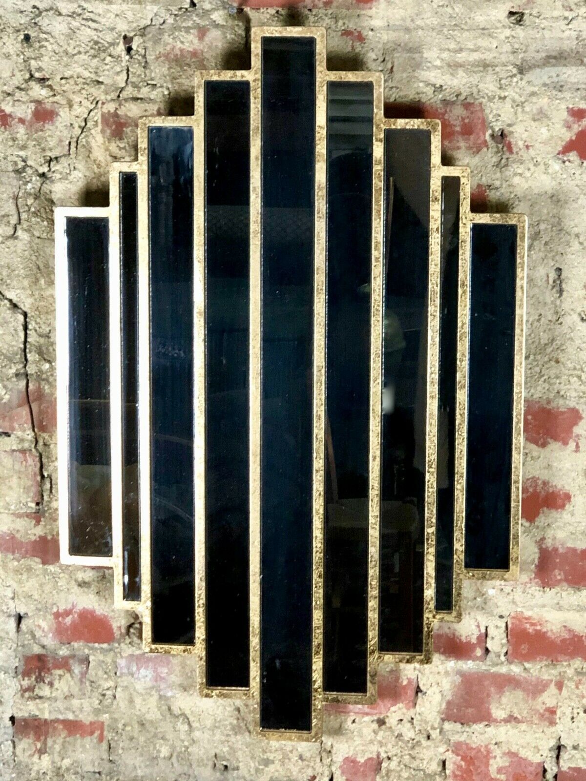 Art deco style "miami" mirror in patinated gilded wood 80x52cm
