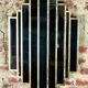 Art deco style "miami" mirror in patinated gilded wood 80x52cm