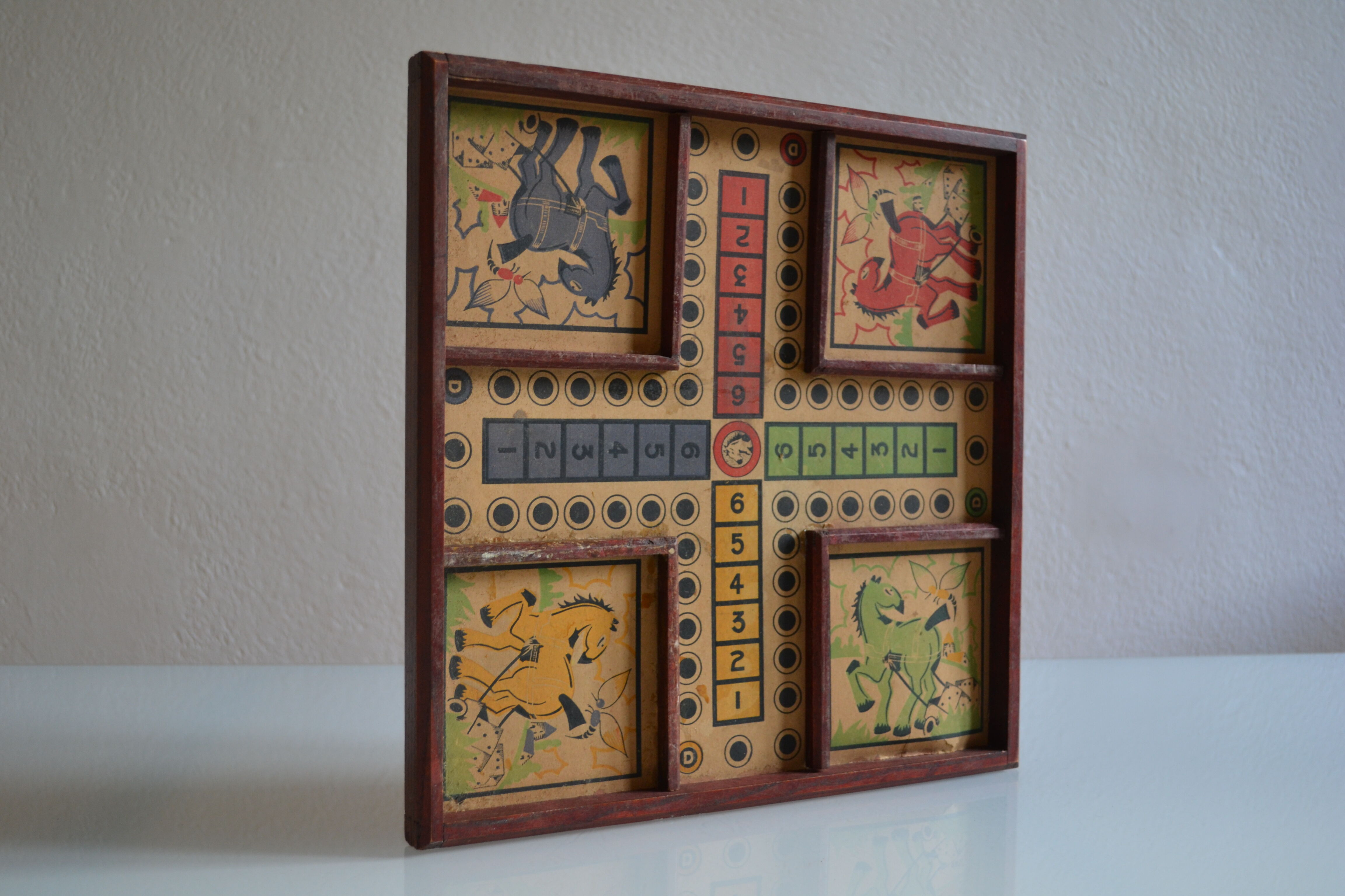 Old game board of small horses