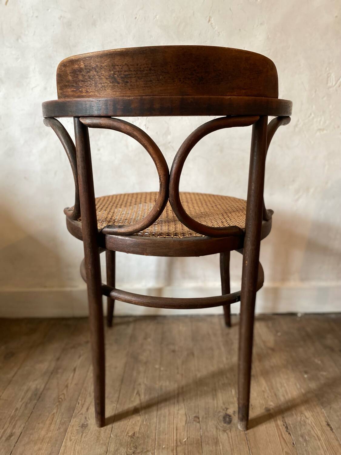 Cane and curved wood armchair