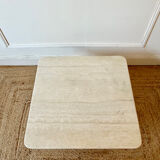 Square coffee table in travertine.