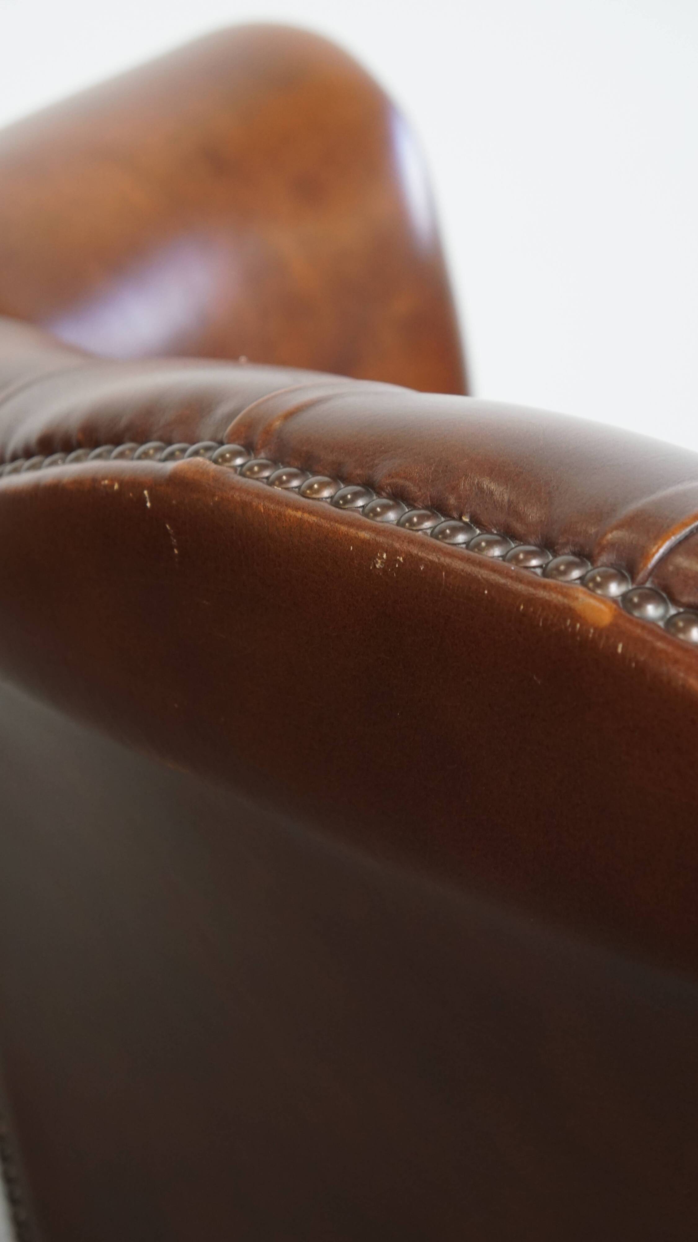 Chesterfield wing chair in dark brown English cowhide