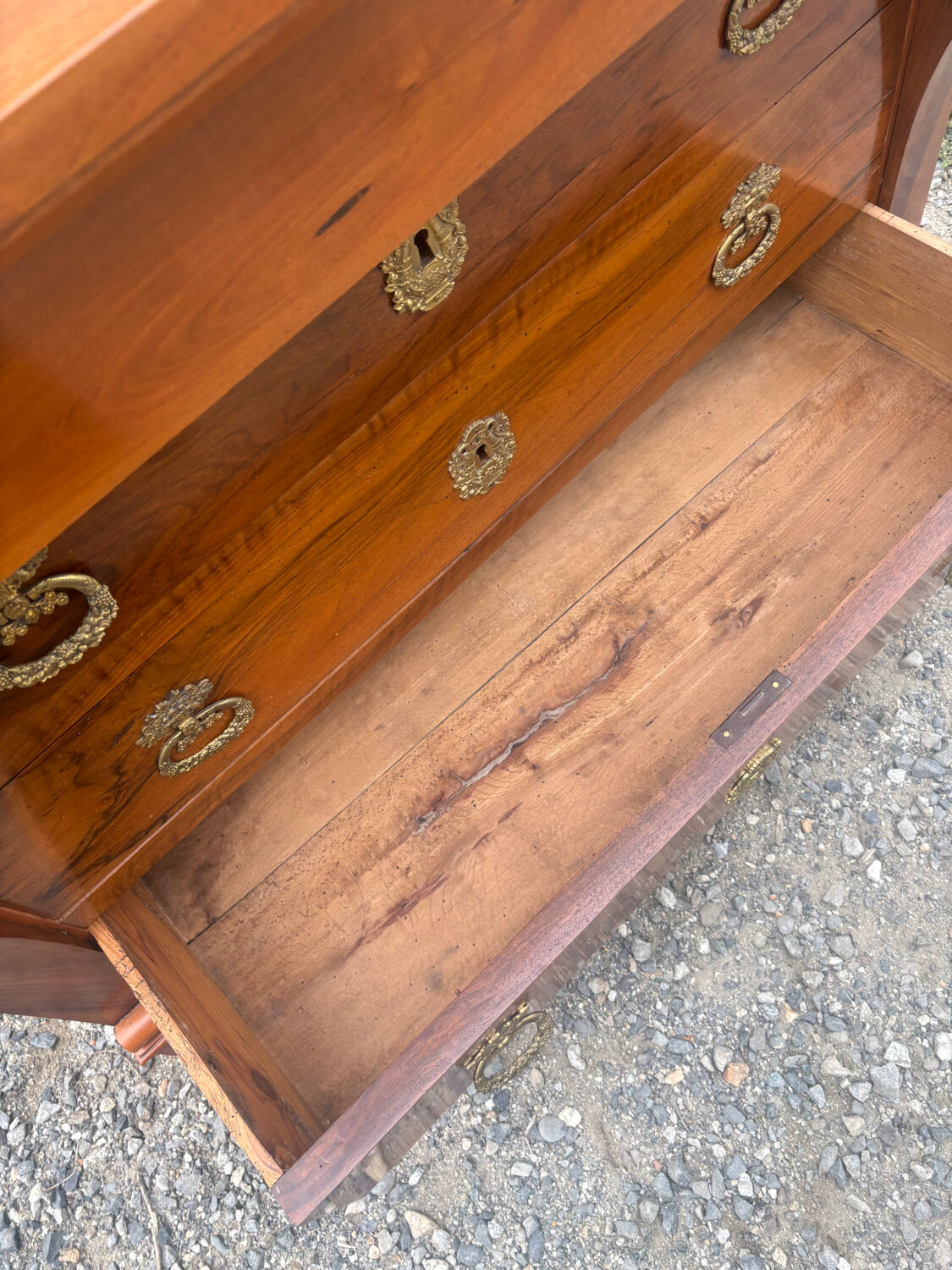 Restoration period walnut chest of drawers with a scroll handle