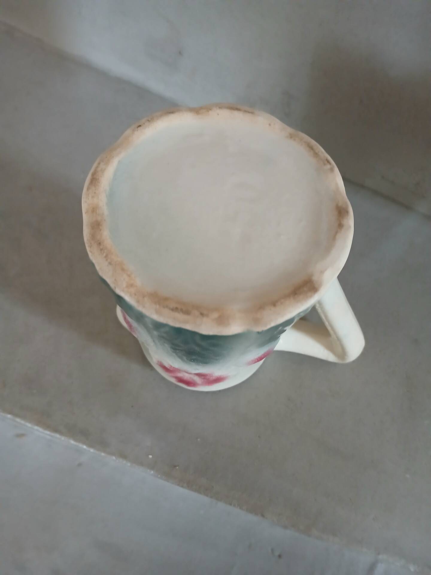 Small antique jug in slipware.