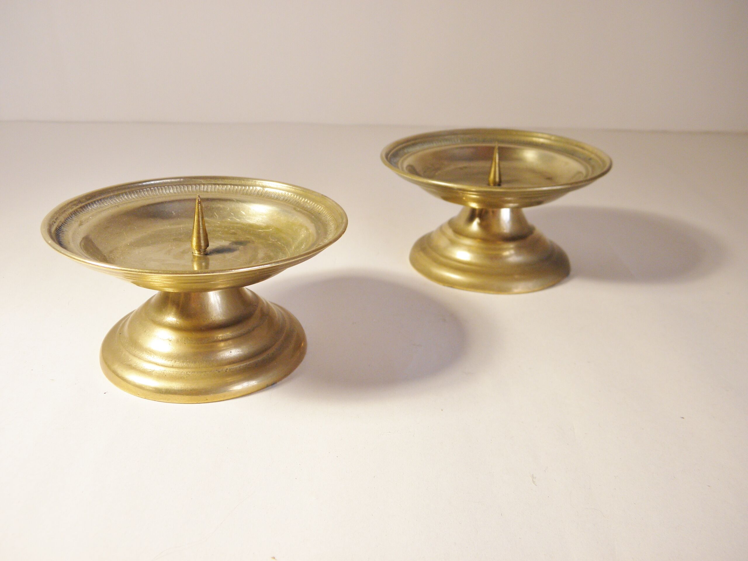 Pair of golden brass candlesticks