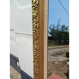Wooden mirror and gold trim