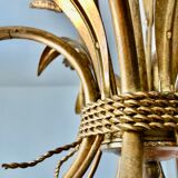 Golden suspension 5 fires with a bouquet of ears of wheat