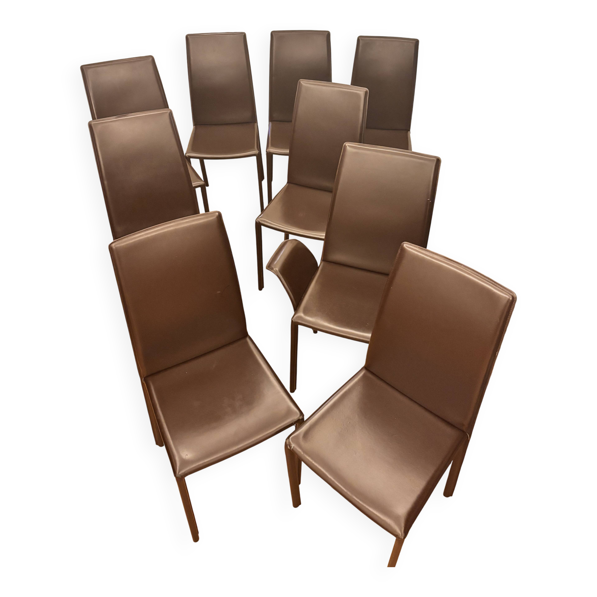 Many brown leather chairs "Roche Bobois"