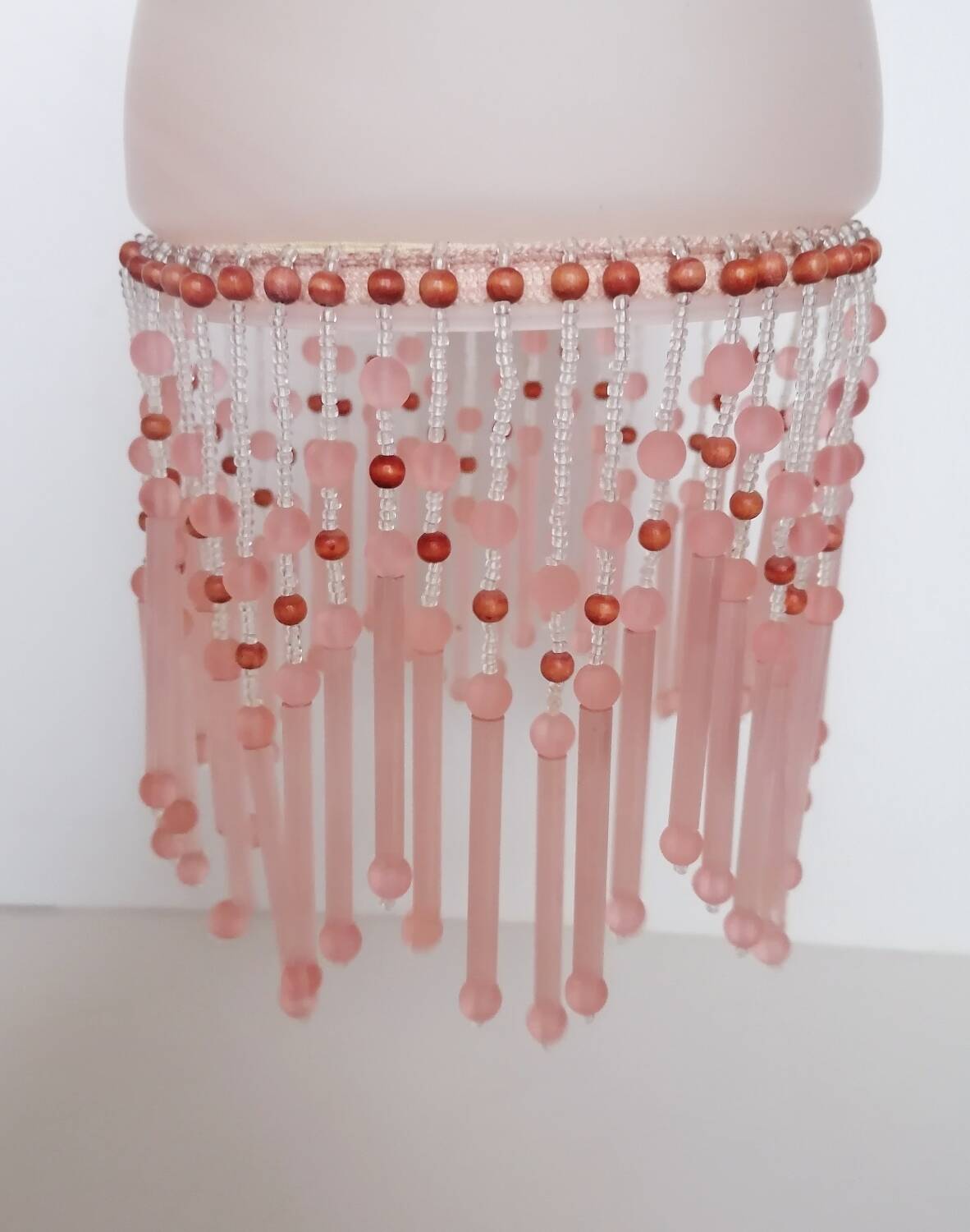 Pink glass wall lamp with garland of pearls