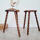 Pair of old wooden tripod stools