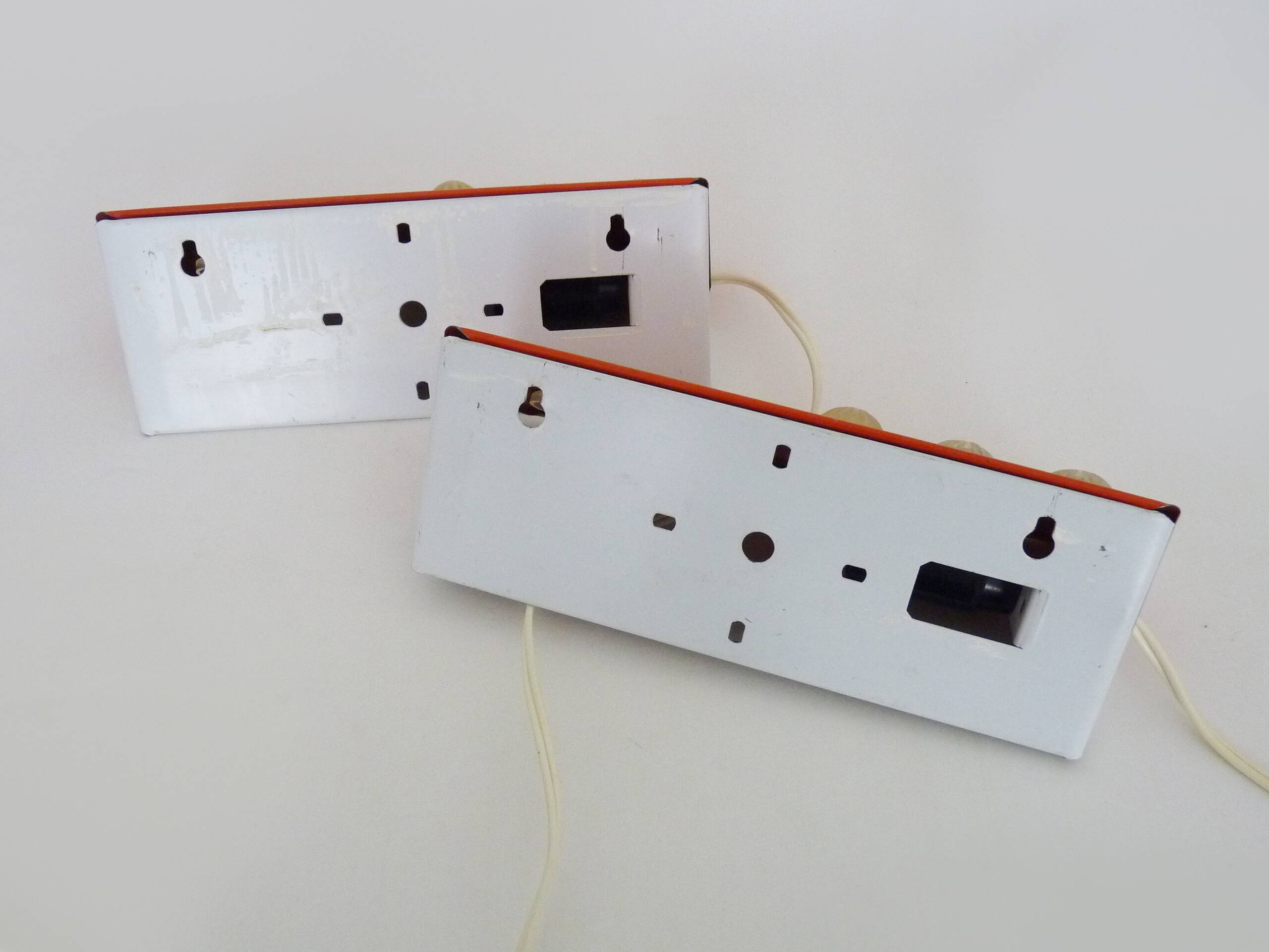 Pair of Scandinavian wall sconces with swivel shade in orange metal. 70