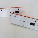 Pair of Scandinavian wall sconces with swivel shade in orange metal. 70