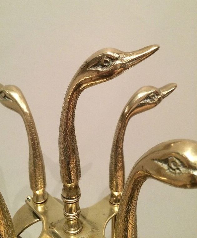 Fire necessary for the brass duck heads in the style of Maison Jansen.