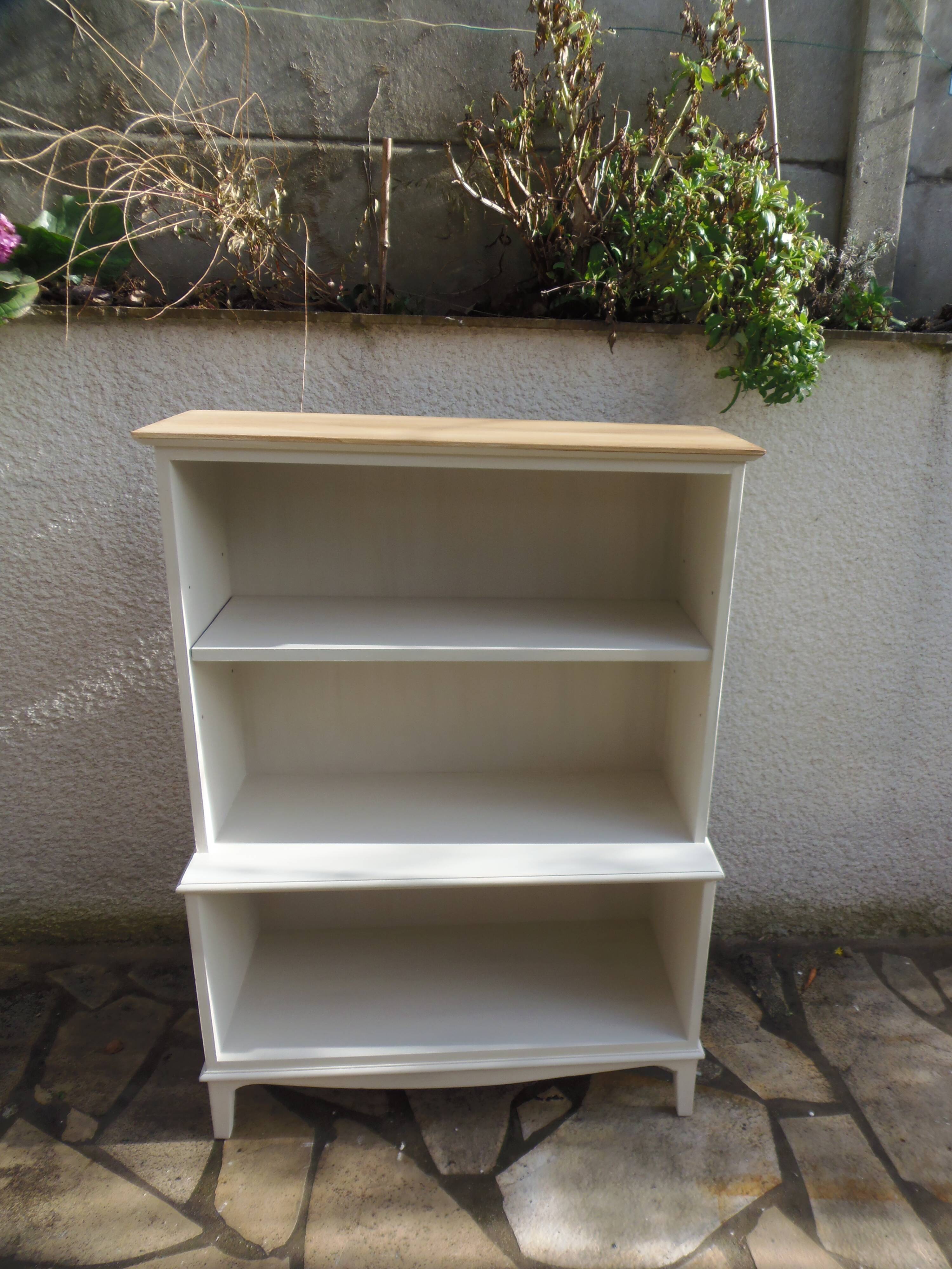 Vintage library enhanced in beige, wooden top.