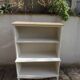 Vintage library enhanced in beige, wooden top.
