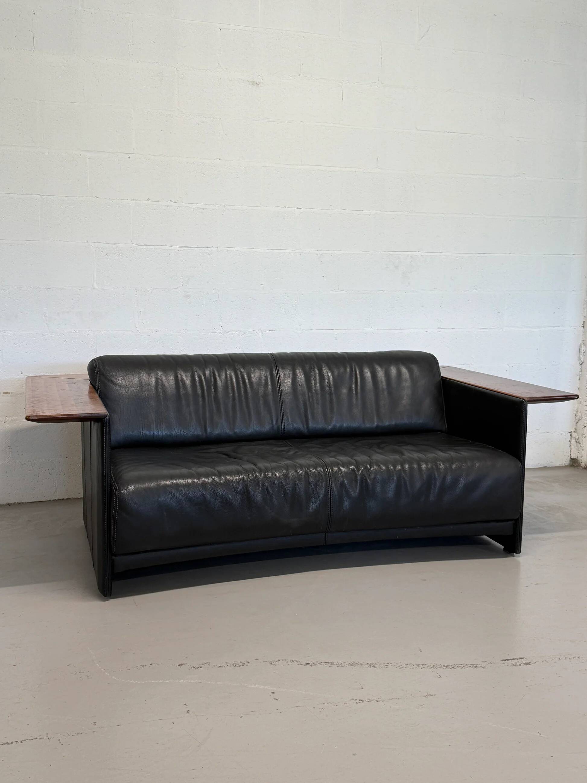 Vintage Black Leather Loveseat with Cantilevered Walnut Tray Arms