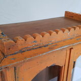 Old temple-showcase with teak offerings