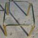 Nested table in gold metal and glass