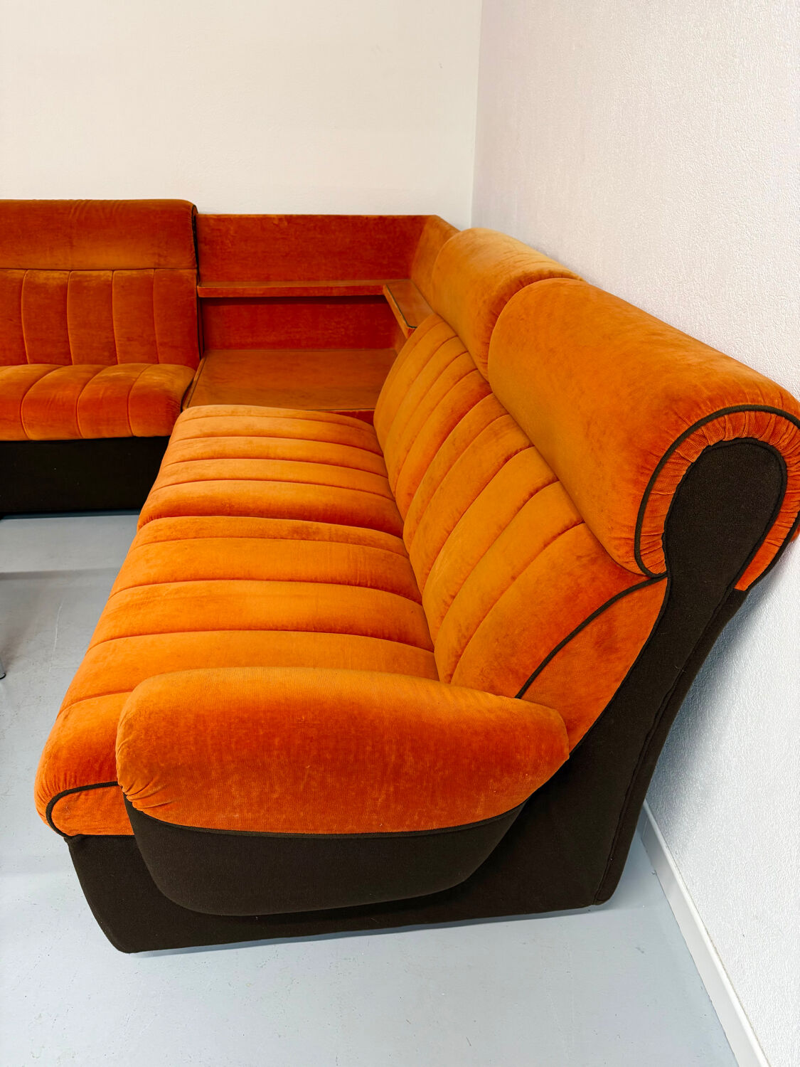 Modular vintage orange corner sofa, 1970s pop design.