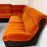 Modular vintage orange corner sofa, 1970s pop design.
