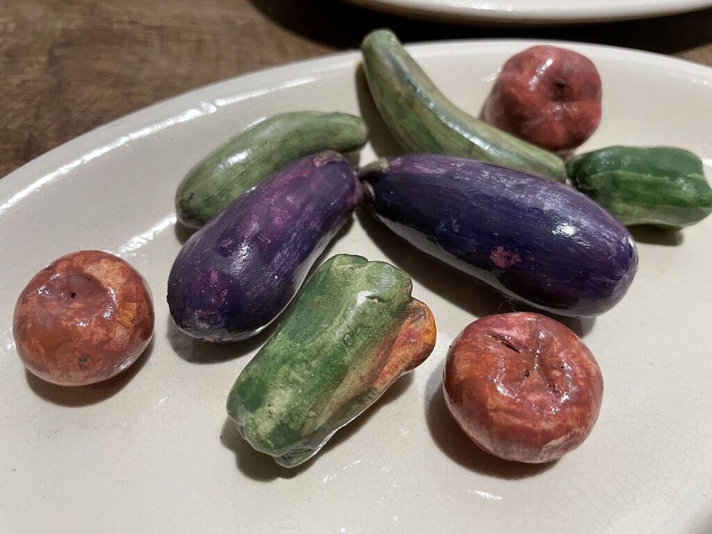 3 plates decorated with vegetables