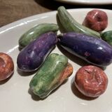 3 plates decorated with vegetables
