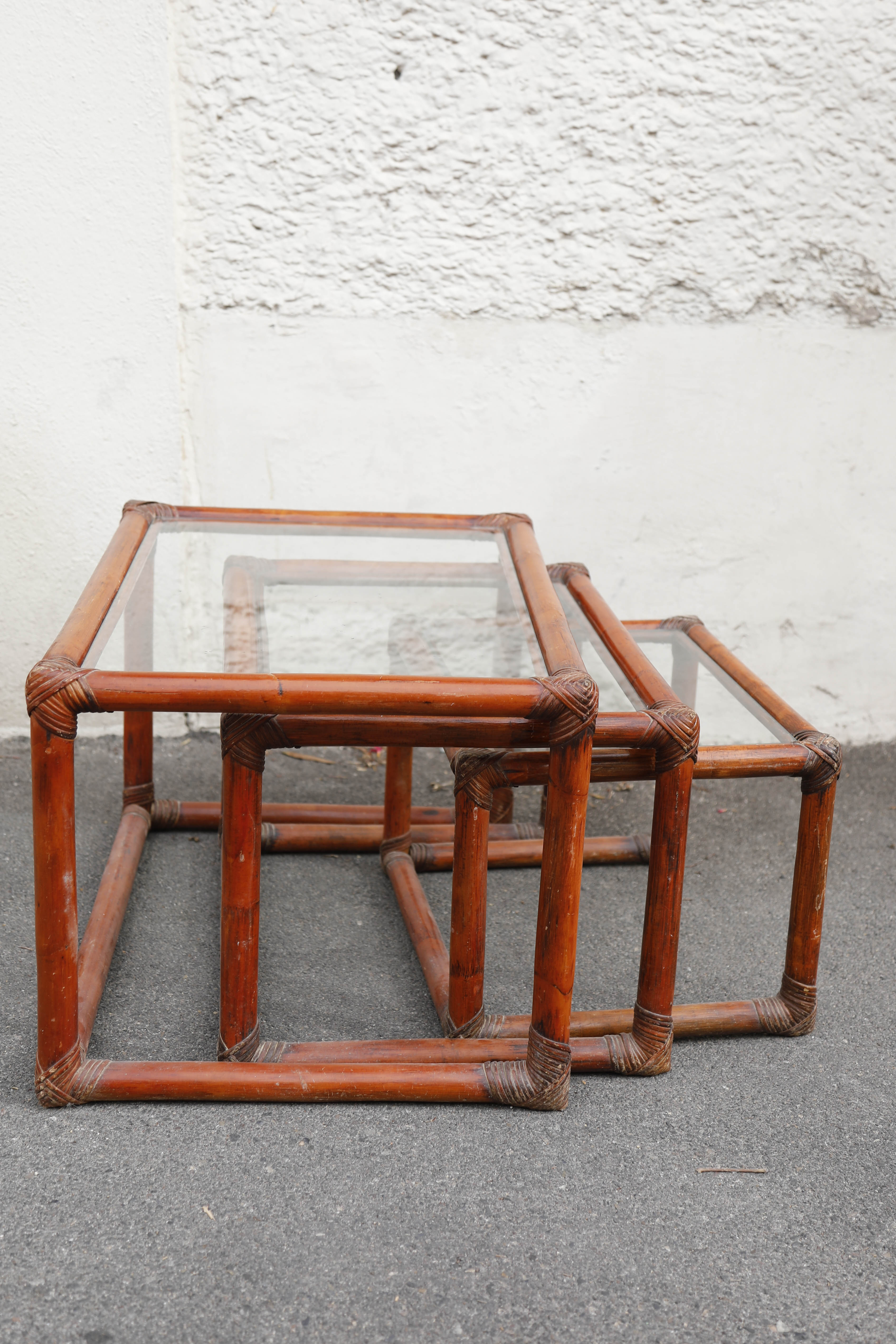 Rattan and glass side tables