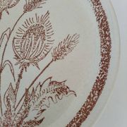 A pair of vintage plates with a rust-brown thistle design – 1950s.