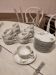 Coffee and tea cup service with plates and saucers.