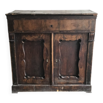 Vintage brown pine dresser with a painted top, moulded panels, and decorative locks.