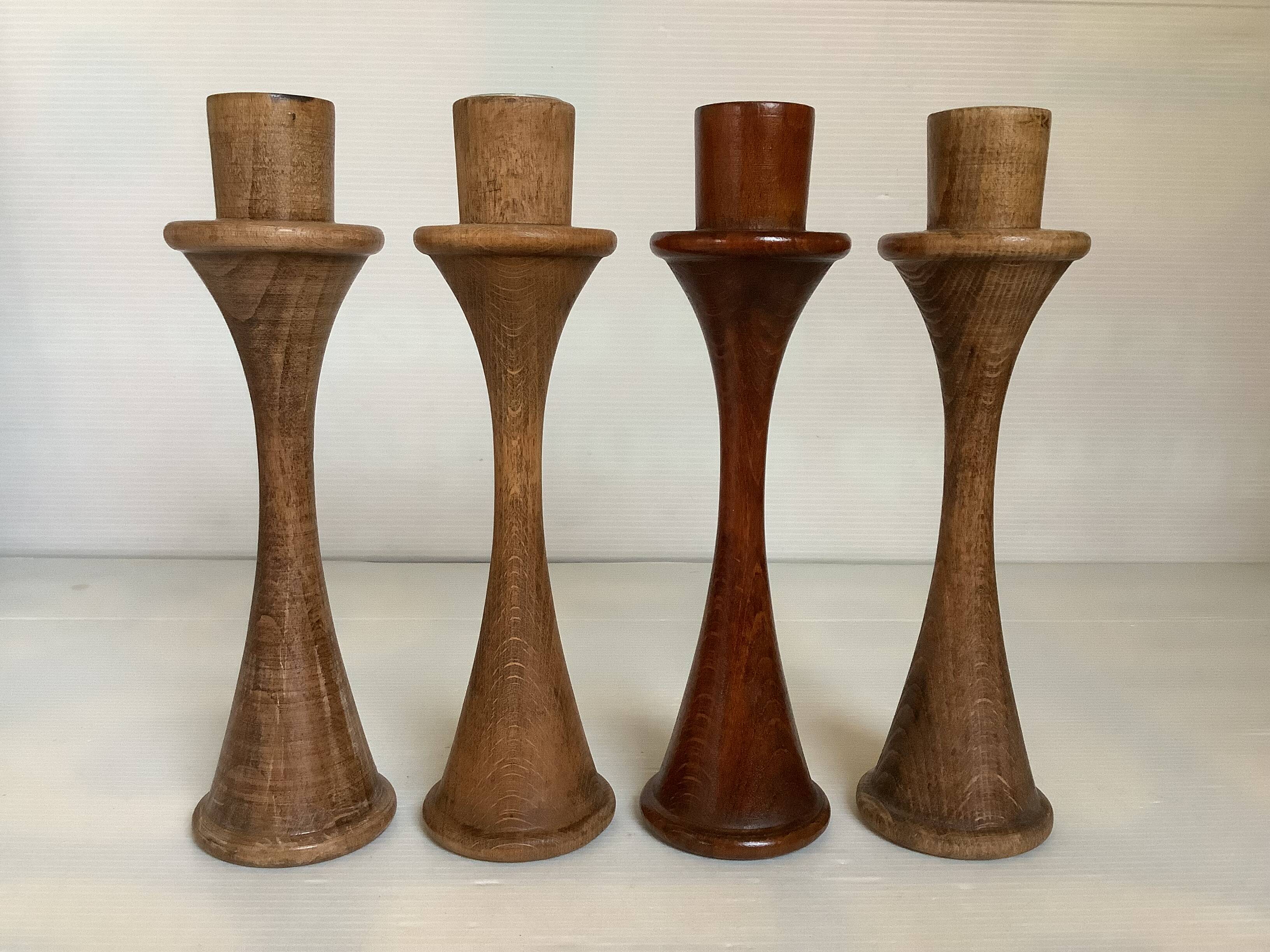 Four Scandinavian-style wooden candle holders