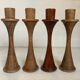 Four Scandinavian-style wooden candle holders