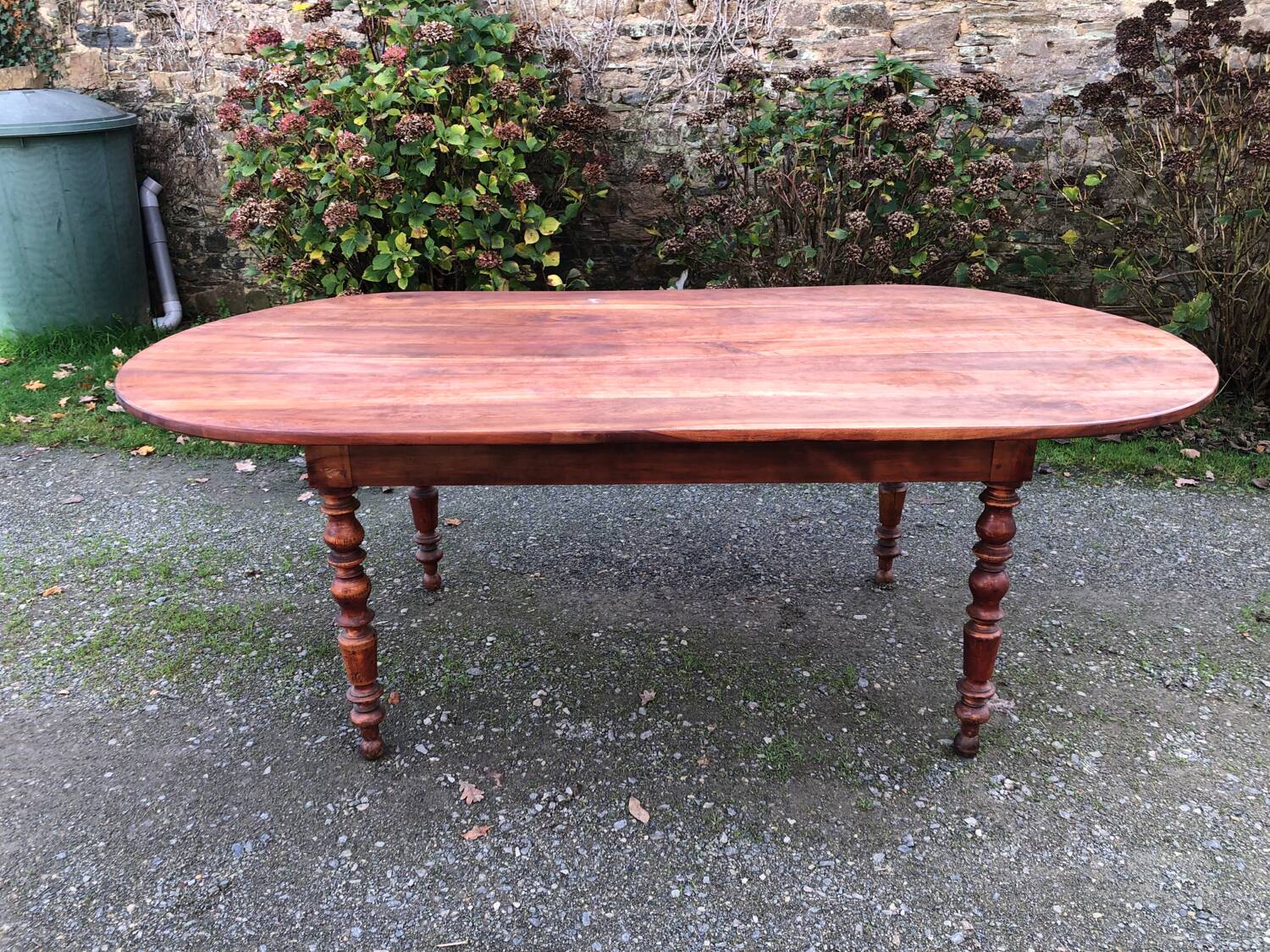 Antique cherry wood farmhouse table with rounded ends