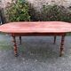 Antique cherry wood farmhouse table with rounded ends