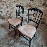 Pair of antique Napoleon III chairs in blackened wood and fabric