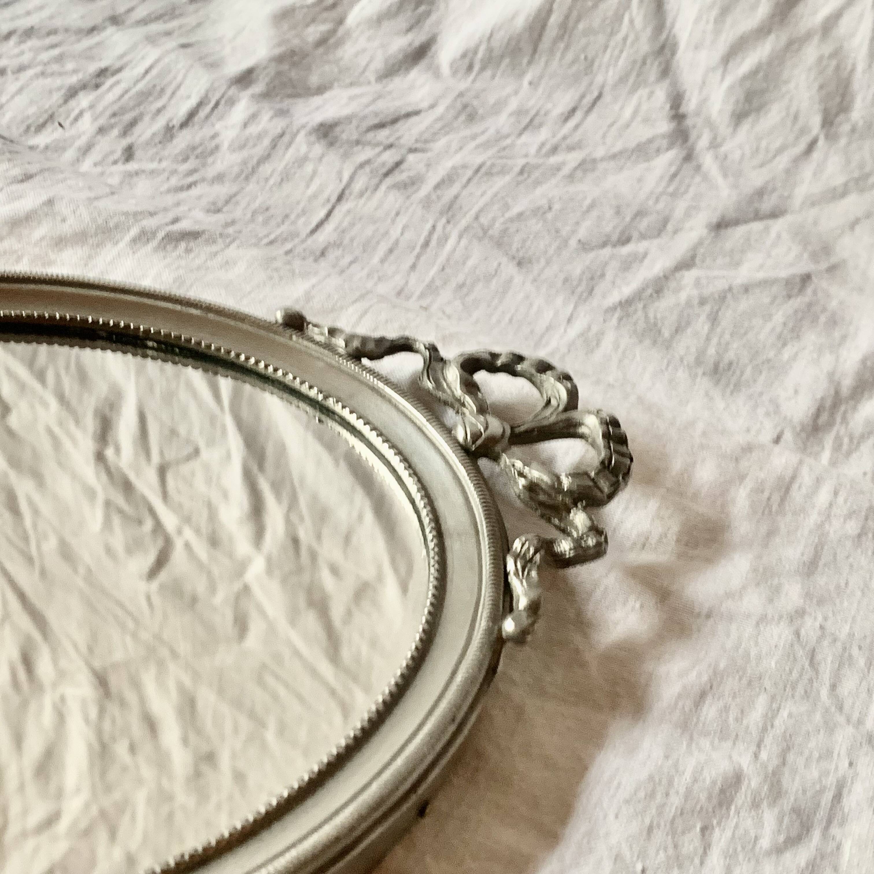 Louis XVI style oval metal wall mirror